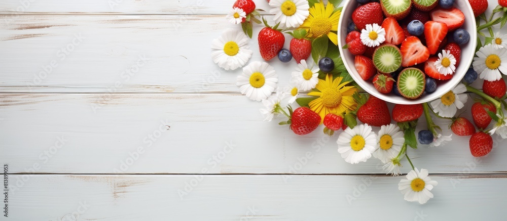 Poster A top down view of a white table adorned with a vibrant arrangement of summer flowers and a bowl overflowing with fresh strawberries Ample space for additional images