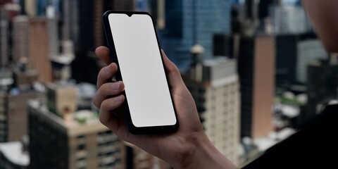 Smartphone with blank screen over cityscape, ideal for urban tech promotions