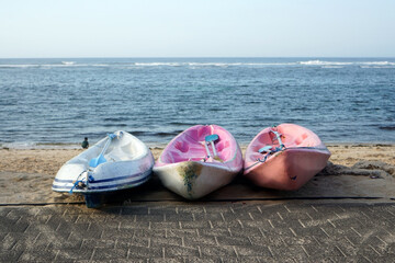 The canoe and its paddles are displayed on Melasti Beach