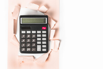 Scientific calculator in torn sheet of paper.