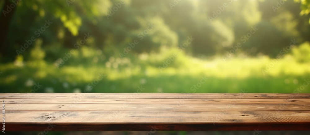 Poster a wooden table with no items on it set against a blurred green background providing ample space for 