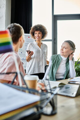 Beautiful diverse businesswomen discussing ideas at desk in modern office.