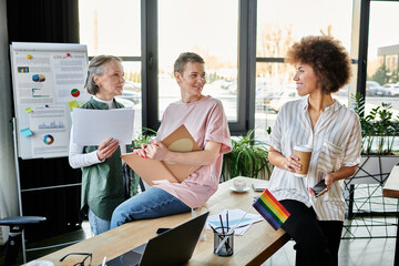 Diverse group of hardworking businesswomen at a table in a coworking space.