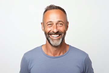 Portrait of a joyful man in his 40s smiling at the camera isolated on white background