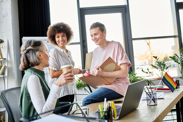 Cheerful diverse female professionals talking about their project in office.