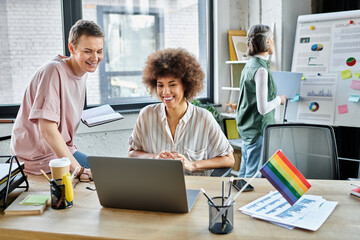 Attractive diverse female professionals working together on their project in office.