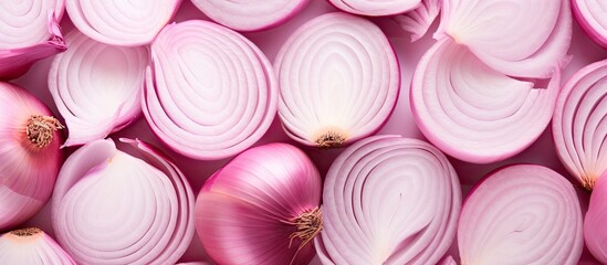 The image showcases a beautiful arrangement of sliced pink onions forming an isolated pattern within a frame The copy space makes it the perfect food background