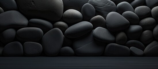 Obraz premium Black background with a stone abstract design providing ample copy space for images