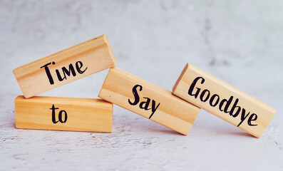 Time to say goodbye on a wooden cubes 