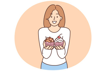 Smiling woman offer cupcakes