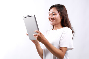 Smiling busy young asian college student woman using tablet computer, happy student woman in casual...