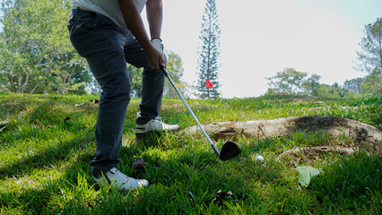 Golfer are playing game golf and hitting go on green grass mountain background.