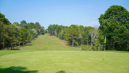View of Golf Course with beautiful putting green. Golf course with a rich green turf beautiful scenery.