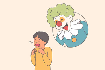 Hysterical behavior of little boy, seeing clown and frightened due to coulrophobia