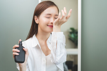 Perfume of essential aroma, beauty concept. attractive perfect asian young woman holding perfume...