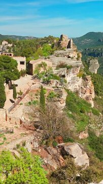 Aerial view of Siurana village perched atop an escarpment in the Prades Mountains, overlooking the Siurana Reservoir in Spain