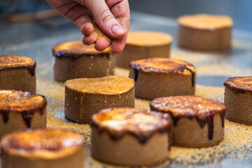 A tart is caramelized with a hot iron. Caramelization process.