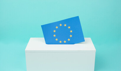 Fototapeta premium EU election, ballot box, european union flag, blue and yellow stars, citizens of Europe voting Parliament