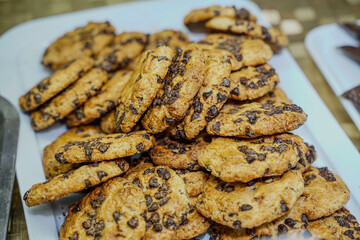 cookies with chocolate specks, arranged on a tray, where they will be tasted