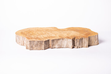 Cross section of a crooked tree trunk with growth rings on a white background. Close-up.