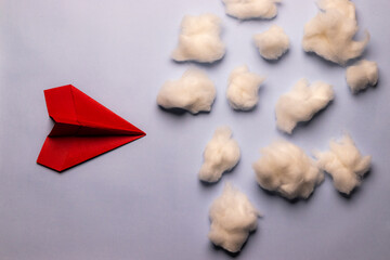 Red paper plane with cotton clouds, business concept, growth concept