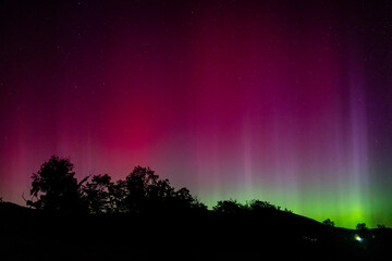 The Aurora Borealis or Northern Lights dance in the skies of Natural Bridge, Virginia