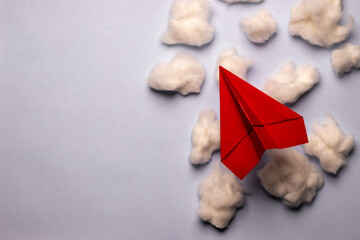 Red paper plane with cotton clouds, business concept, growth concept