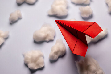 Red paper plane with cotton clouds, business concept, growth concept