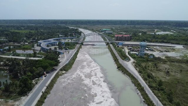 drone video shot of a river barrage with green swallow wetland in India