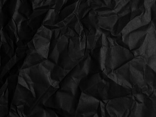 black wrinkled paper texture background