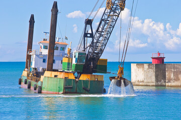Ship for dredging the silted seabed in the Italian harbour of Marina di Pisa - Italy