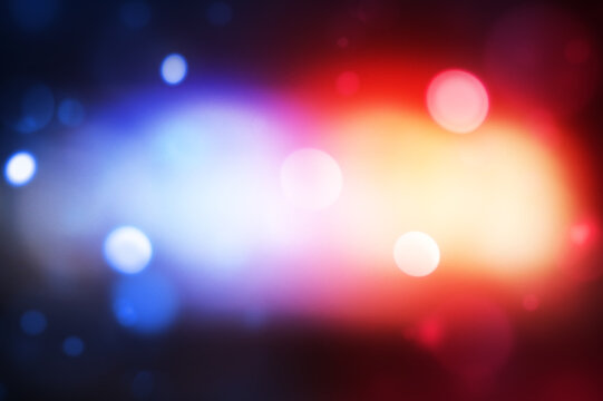 Police light glowing in bokeh blur style, background design. Modern blue and red police  lights concept backdrop
