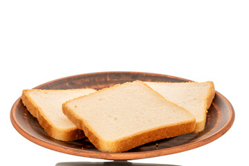 Three pieces of white toaster bread on a clay plate, macro, isolated on white background.