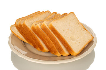 Several pieces of white toaster bread on a ceramic white plate, macro, isolated on a white...