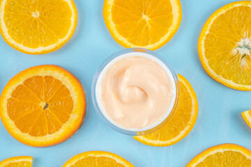 Orange citrus Vitamin C face care - cream, serum. mask, face cleaner, antioxidant moisturizer skin face care and make up concept, with fresh orange fruit slices