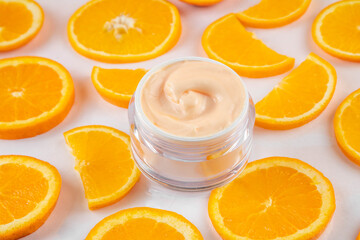 Orange citrus Vitamin C face care - cream, serum. mask, face cleaner, antioxidant moisturizer skin face care and make up concept, with fresh orange fruit slices
