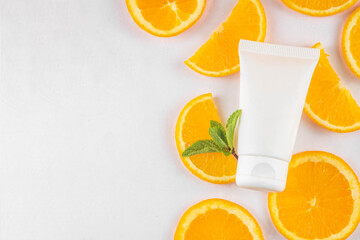 Orange citrus Vitamin C face care - cream, serum. mask, face cleaner, antioxidant moisturizer skin face care and make up concept, with fresh orange fruit slices