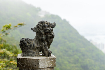 Lion rock statue with green background