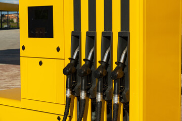 Gas station. Fuel pumps station close up. Petrol pump filling nozzles at gas station