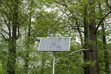 solar panels on a lantern in the park 