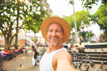nice man taking selfie portrait in San Jose Costa Rica