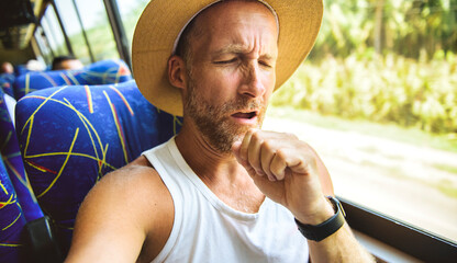 Great man riding in a traveler bus in costa Rica having sick
