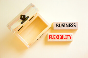 Business flexibility symbol. Concept words Business flexibility on beautiful wooden block. Beautiful white paper background. Empty wooden chest. Business flexibility concept. Copy space.