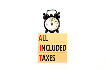 AIT All included taxes symbol. Concept words AIT All included taxes on beautiful wooden blocks. Beautiful white background. Alarm clock. Business AIT all included taxes concept. Copy space.