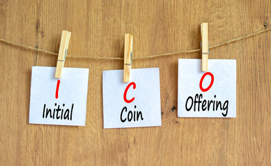 ICO initial coin offering symbol. Concept words ICO initial coin offering on beautiful white paper....