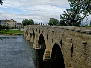 Naklejka premium Béziers, May 2024: Visit the magnificent city of Béziers in Occitanie. Street photos - View of Saint-Nazaire and Saint-Celsus cathedrals With the Pont Vieux