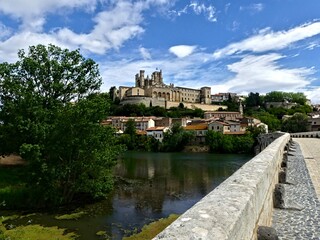 Béziers, May 2024: Visit the magnificent city of Béziers in Occitanie. Street photos - View of Saint-Nazaire and Saint-Celsus cathedrals 
With the Pont Vieux