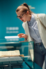 women in the museum looks at art exhibitions.