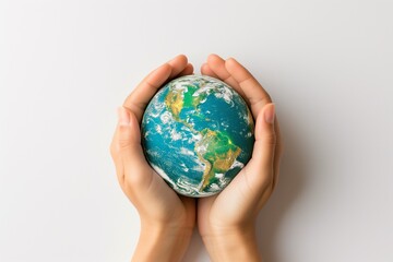 Hands Holding Earth Globe Against Sky Background
