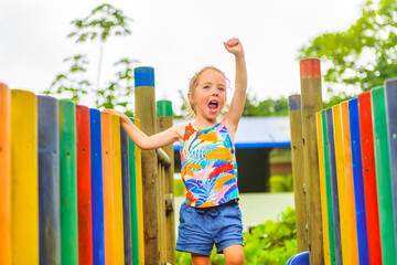 Active little girl having fun on playground